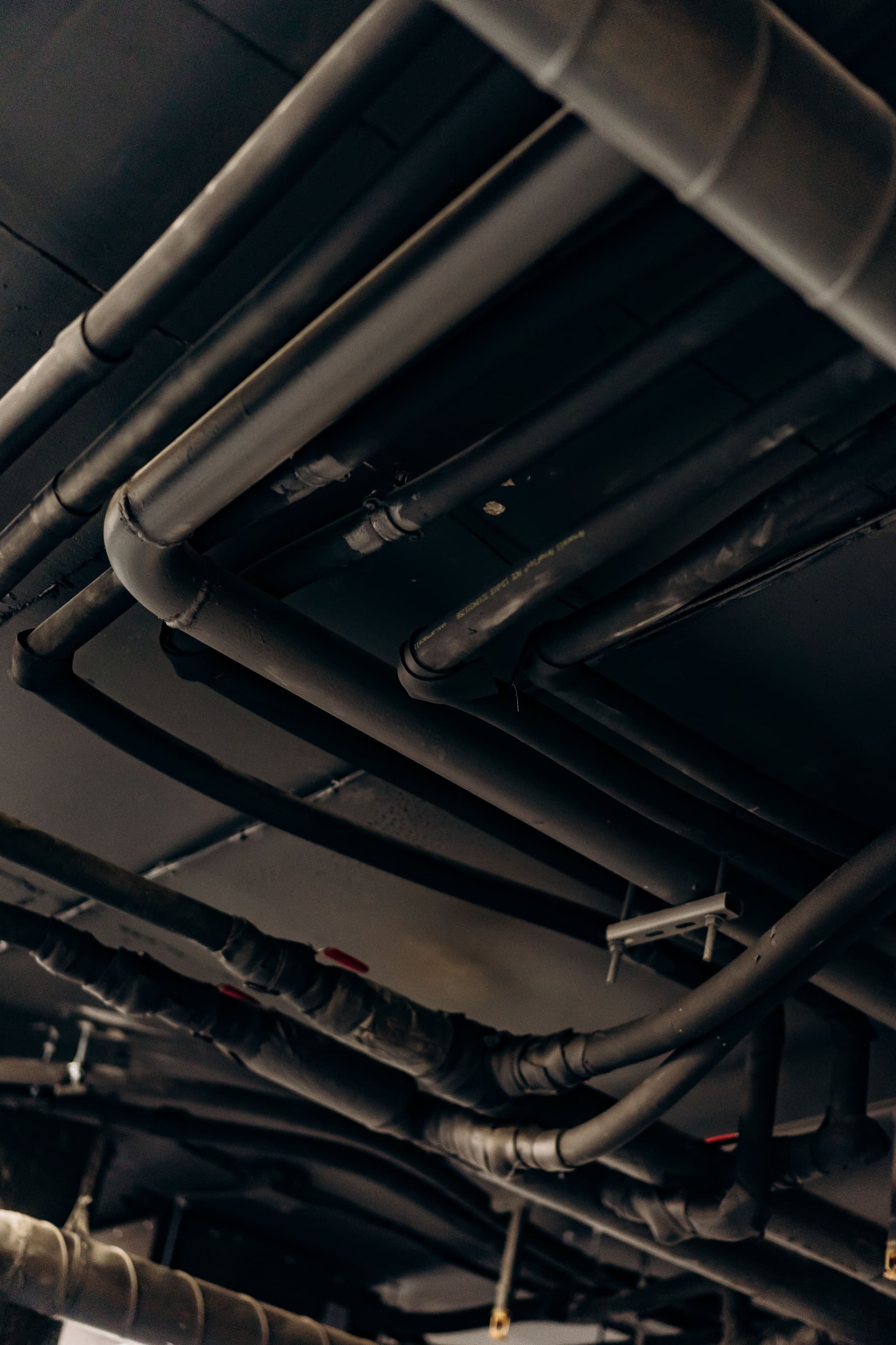 HVAC mechanical room with insulated chilled water piping and air handling units